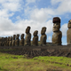 The statue platform with standing moai on the south coast of Rapa Nui. One of the moai is adorned with a red scoria pukao.